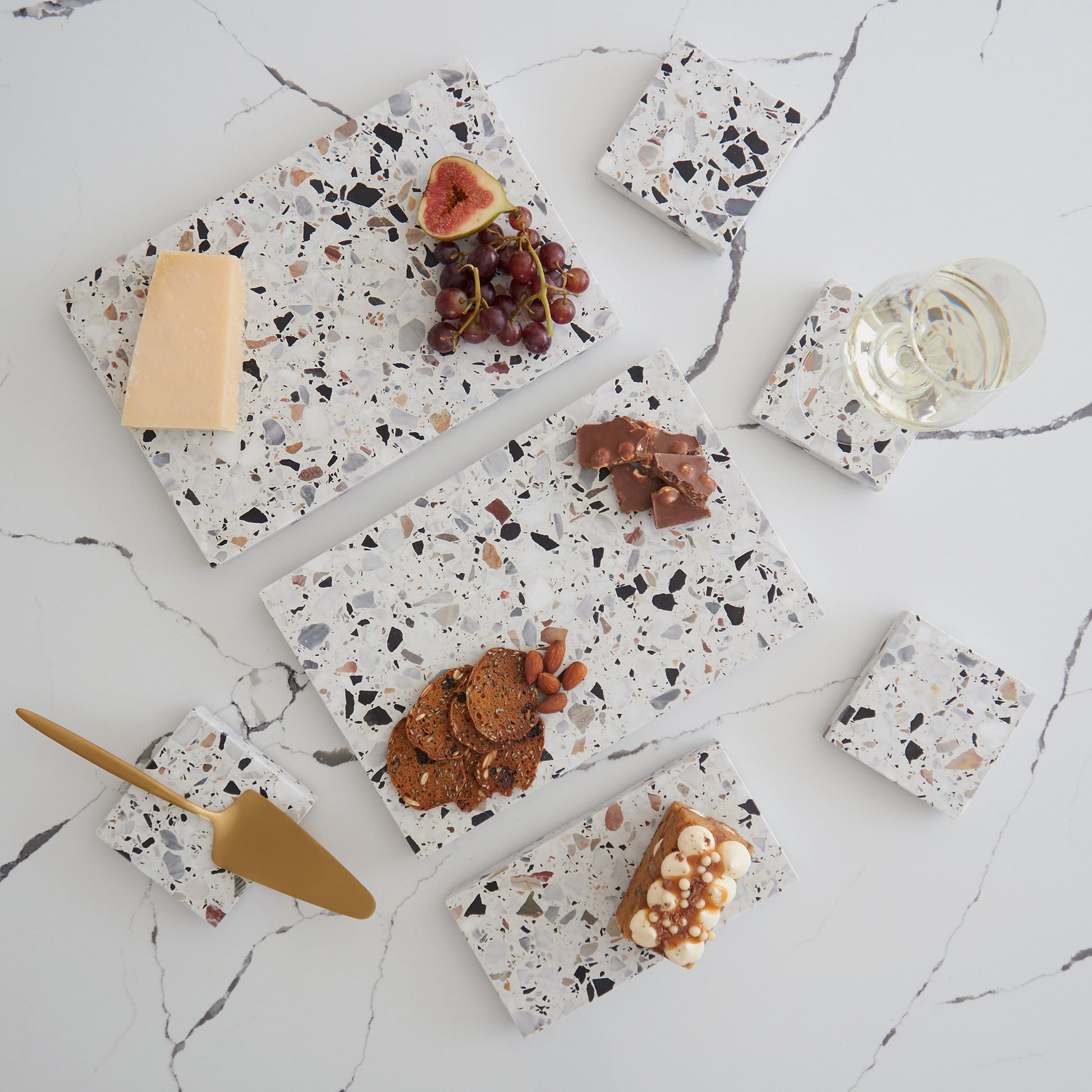 Sharing Set in Autunno – handcrafted terrazzo platters and matching coasters for striking tablescapes.