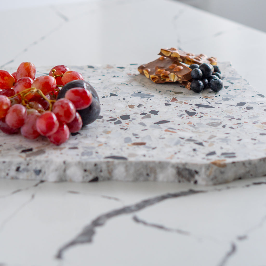 Autunno organic terrazzo platter styled with chocolate and fruit.
