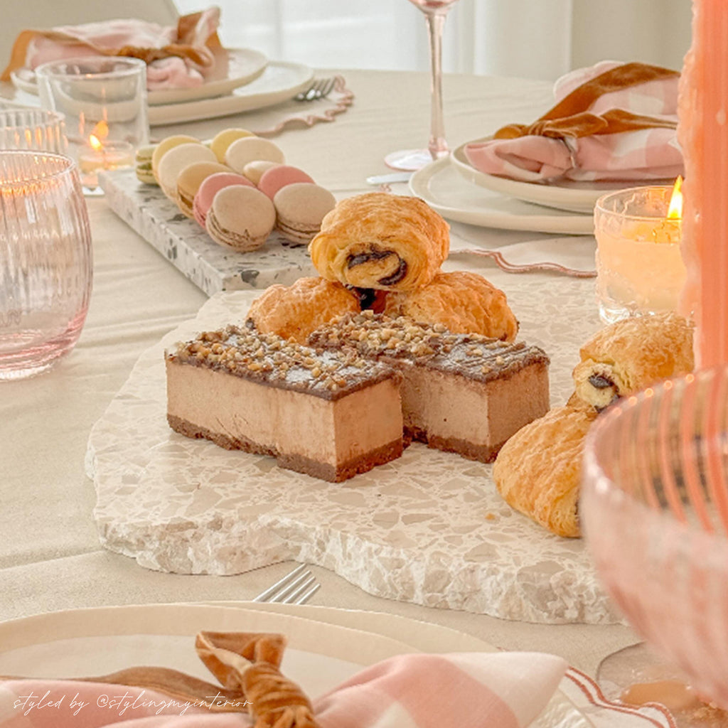 Insieme Homewares terrazzo platters styled with chocolate mousse cake, pastries, and macarons on a soft-toned tablescape — showcasing handcrafted stoneware for elevated dessert presentation and elegant entertaining.