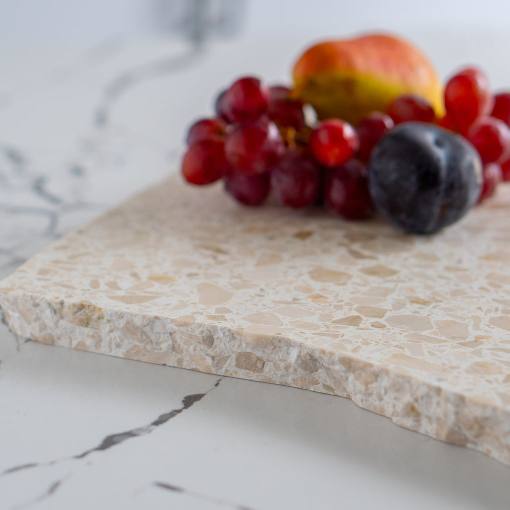 Organic terrazzo platter in colour Estate styled with fruit. 
