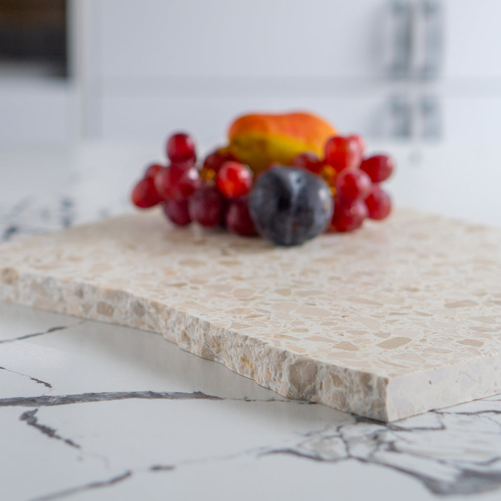 Organic terrazzo platter in colour Estate styled with fruit. 