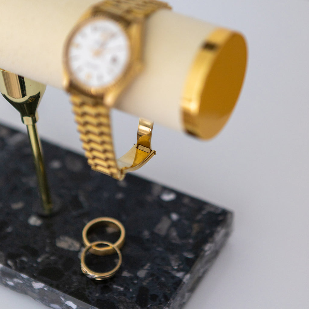 Jewellery and watch displayed on Insieme’s Watch & Jewellery Stand with terrazzo base and jewellery cushions. 