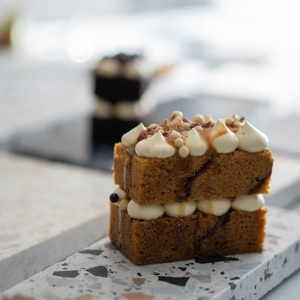 Autunno platter styled with dessert, highlighting light texture and fine grain.