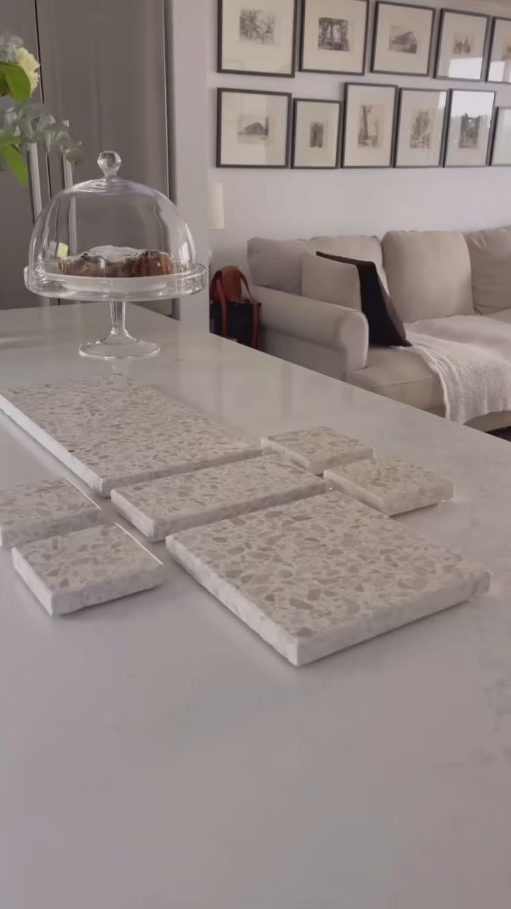 Insieme’s handcrafted terrazzo Entertaining Set featuring a mix of platters styled with fruits, cheeses, and grazing essentials for gatherings.