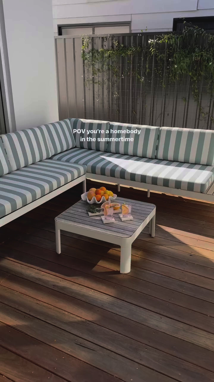 Estate terrazzo coasters and Medium Dessert Dish by Insieme Homewares styled for outdoor entertaining with drinks and citrus garnishes, handcrafted stoneware for elevated alfresco moments.